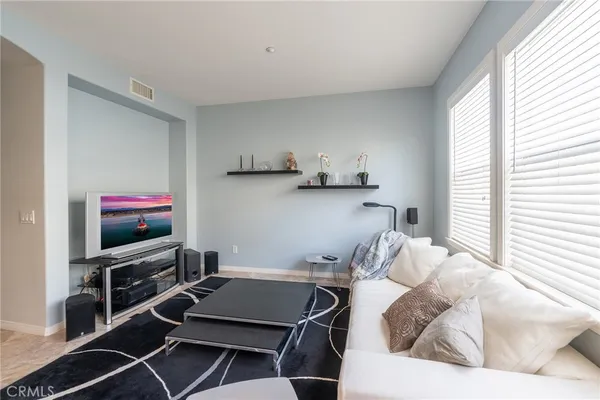 a kitchen with granite countertop white cabinets and a sink