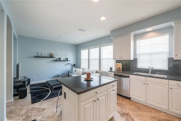 a stove top oven sitting inside of a kitchen