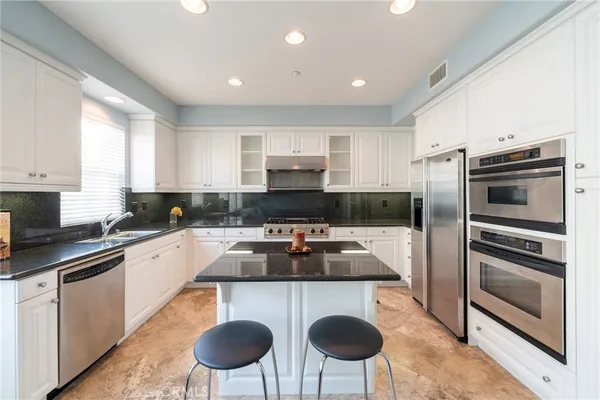 a view of a hallway with wooden floor and a fireplace