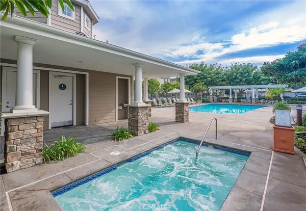 a view of a palm trees in front of a house with a yard