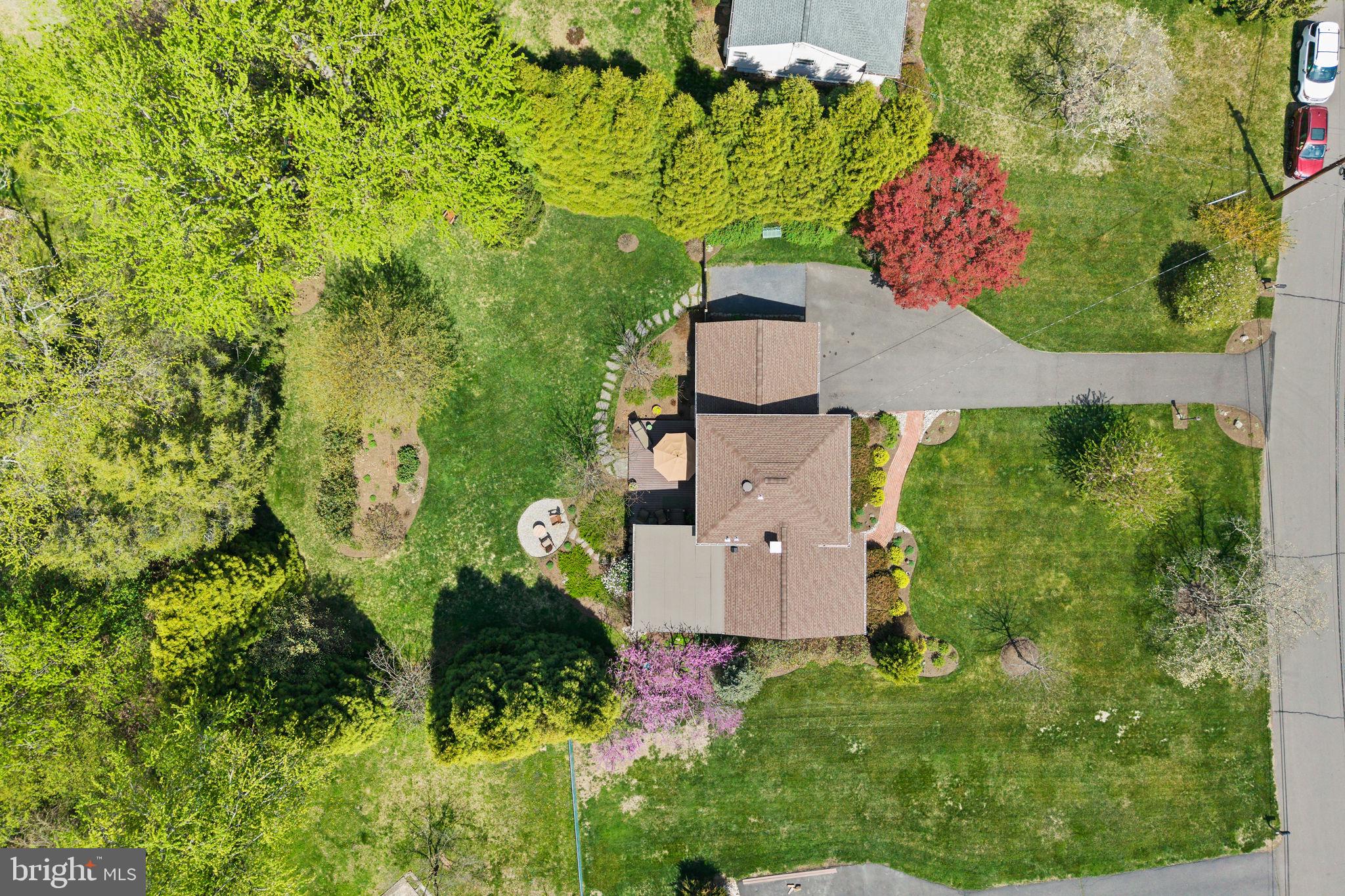 3 Sioux Road Pennington, NJ 08534 - Photo 47 of 47 Lush greenery surrounds a cozy home.