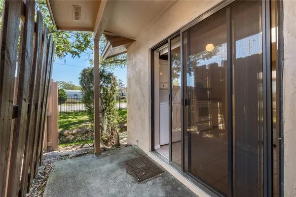 a view of a glass door and porch
