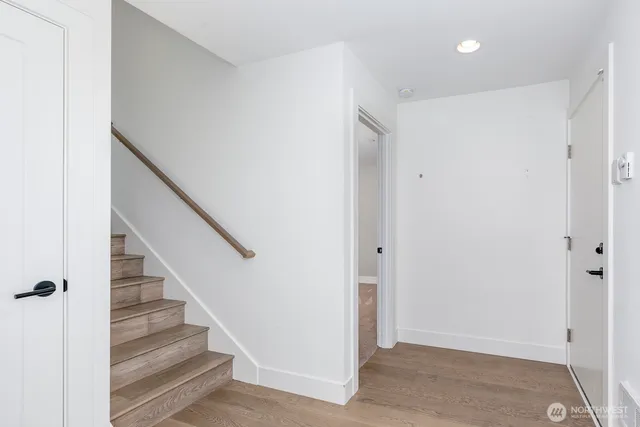 a bathroom with a granite countertop sink mirror toilet and bathtub