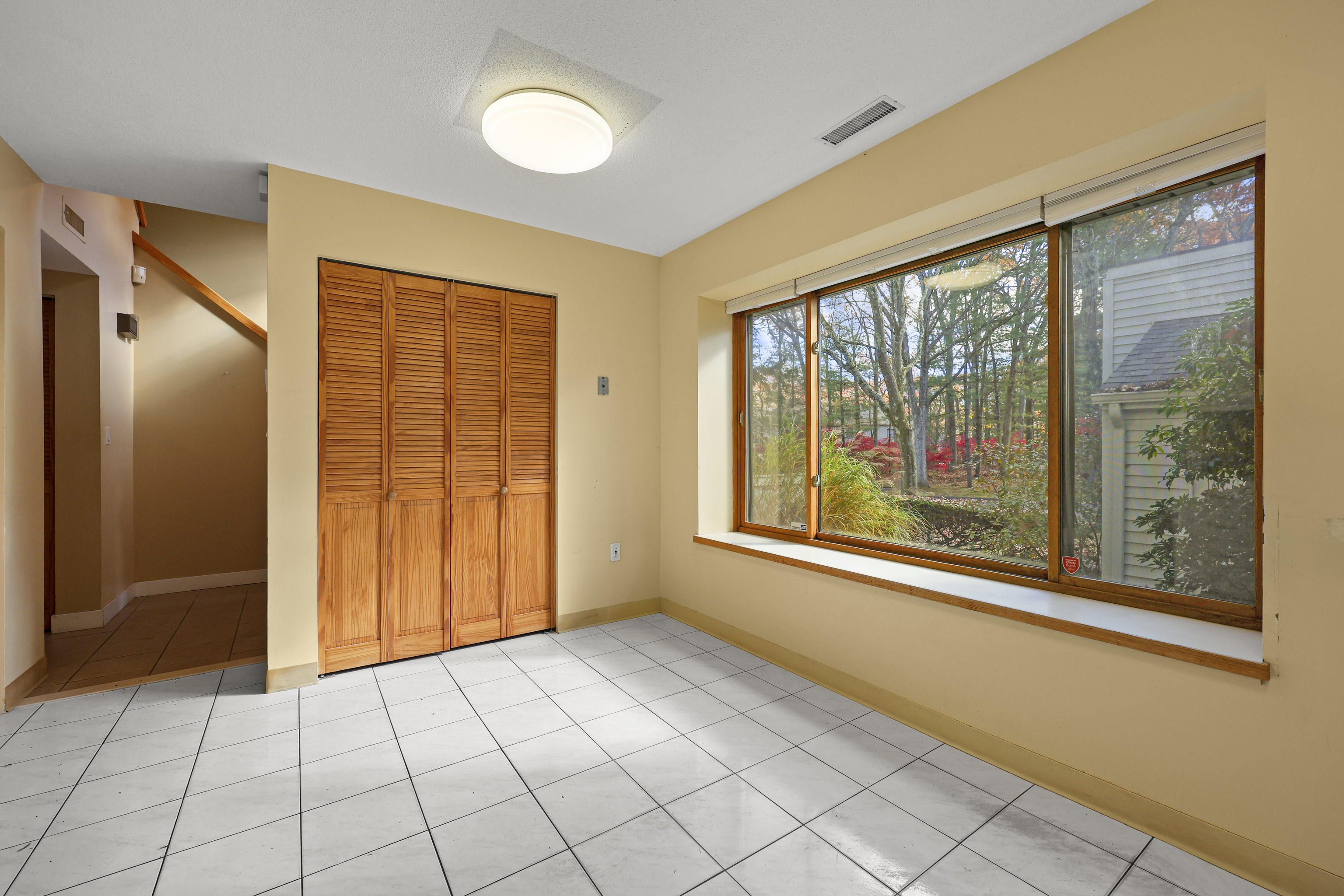 27 Farmington Chase Crescent Farmington, CT 06032 - Photo 12 of 39 a view of an empty room with window chandelier