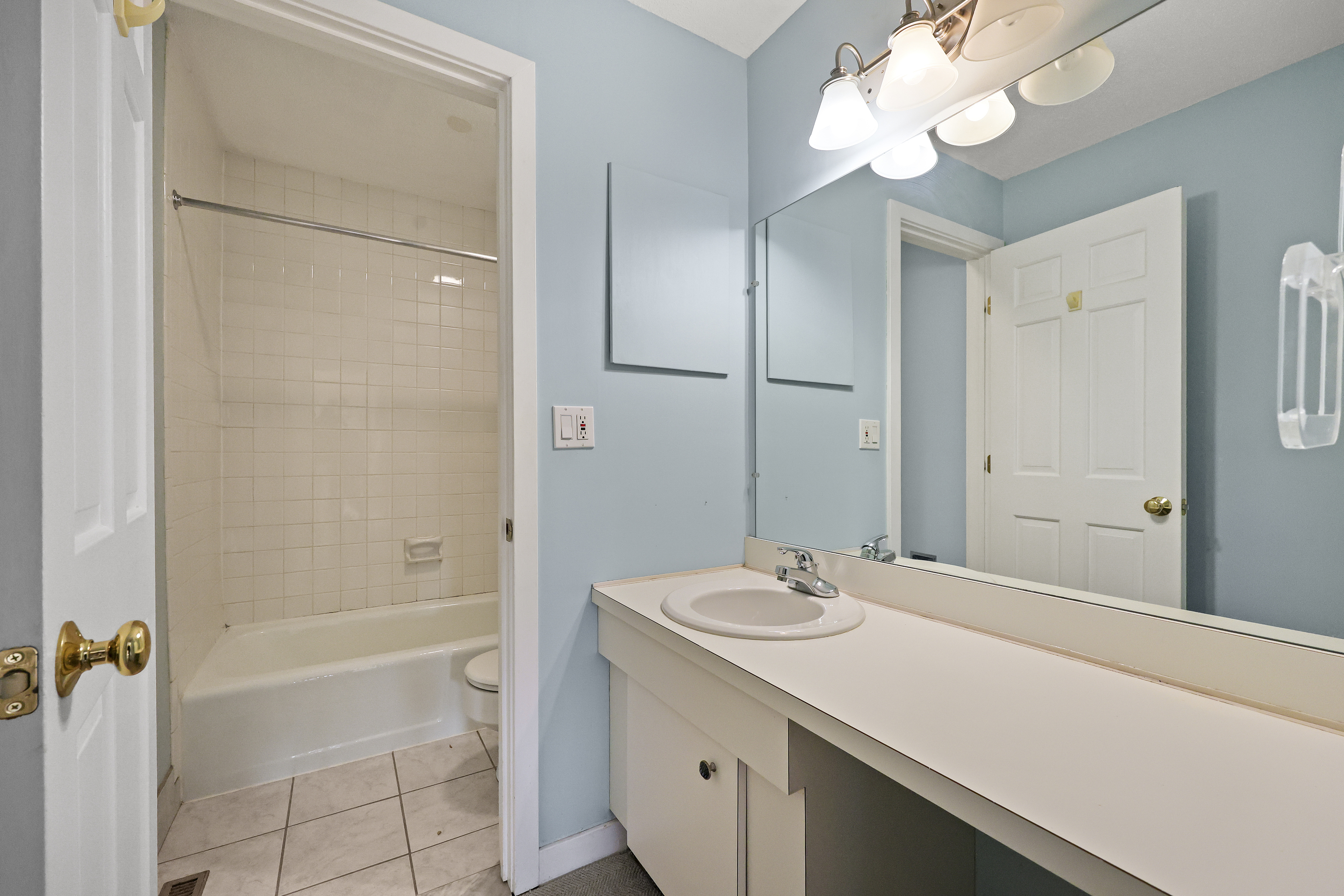 27 Farmington Chase Crescent Farmington, CT 06032 - Photo 19 of 39 a bathroom with a granite countertop sink a mirror and a bathtub