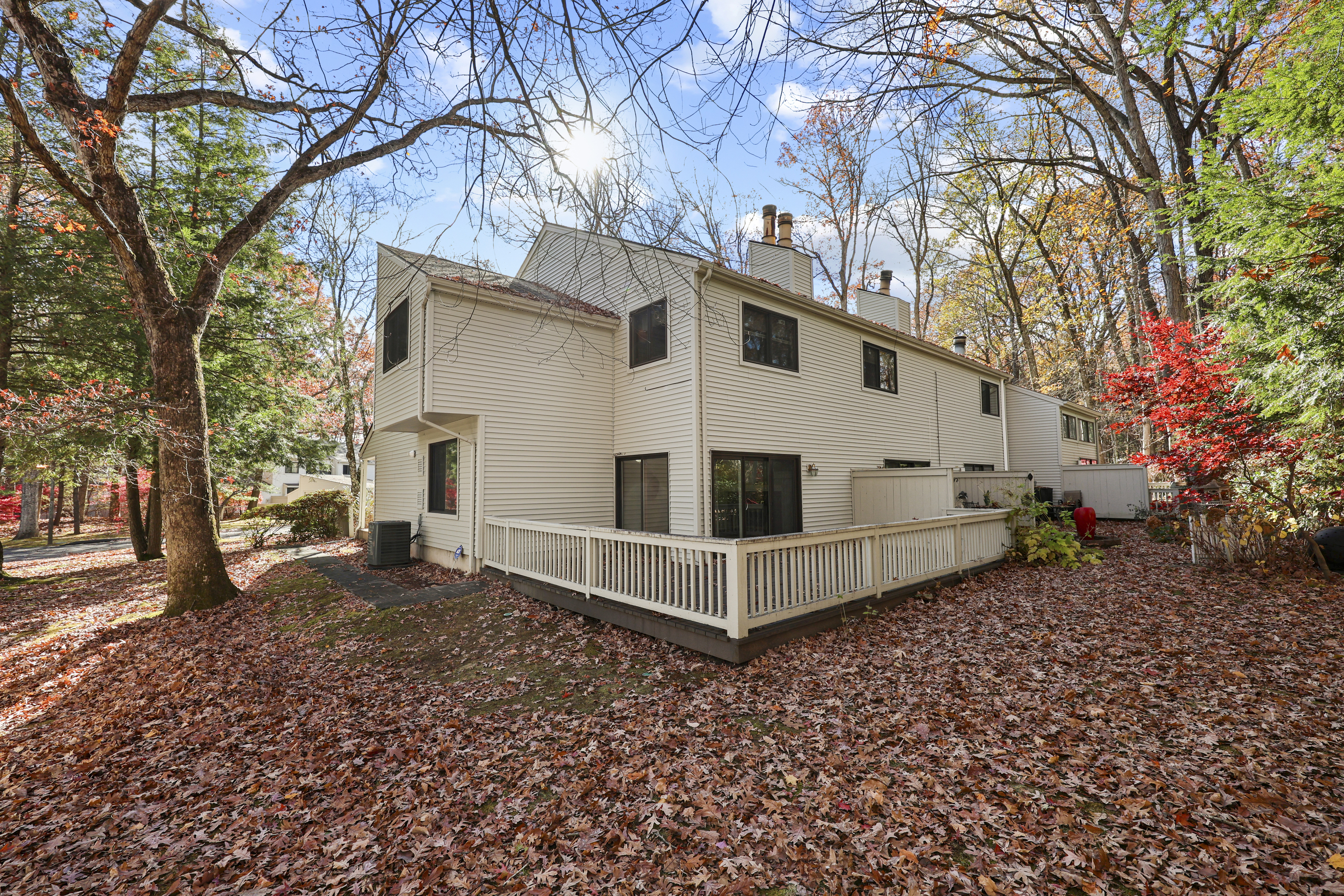 27 Farmington Chase Crescent Farmington, CT 06032 - Photo 27 of 39 a white house that has a tree in front of it