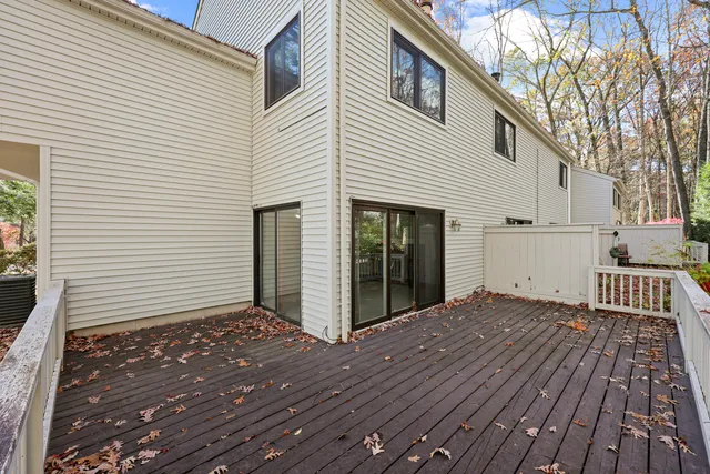 a view of a house with wooden deck