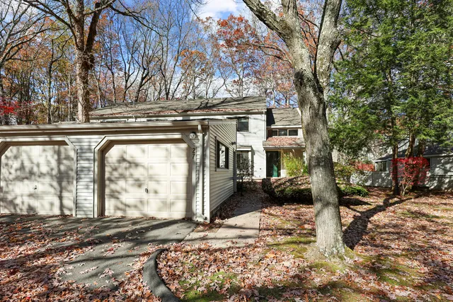 a view of a house with a snow in the yard