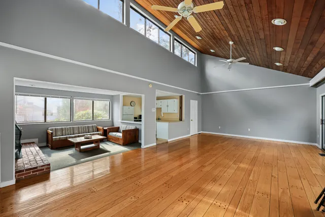 a view of livingroom with furniture and floor to ceiling window