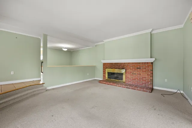 an empty room with fireplace