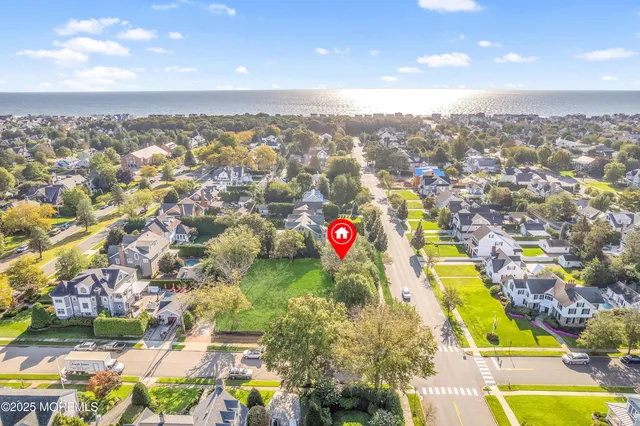 an aerial view of a swimming pool patio and mountain view in back