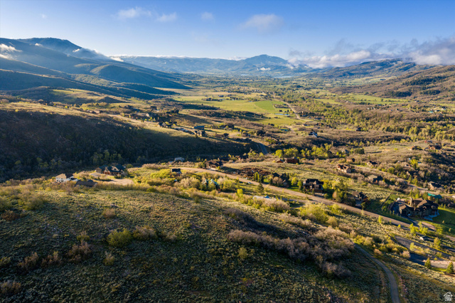 6975 North Durfee Way, Unit 20 Eden, UT 84310 - Photo 6 of 15 Expansive valley landscape featuring rolling hills, distant mountains, and scattered residential properties