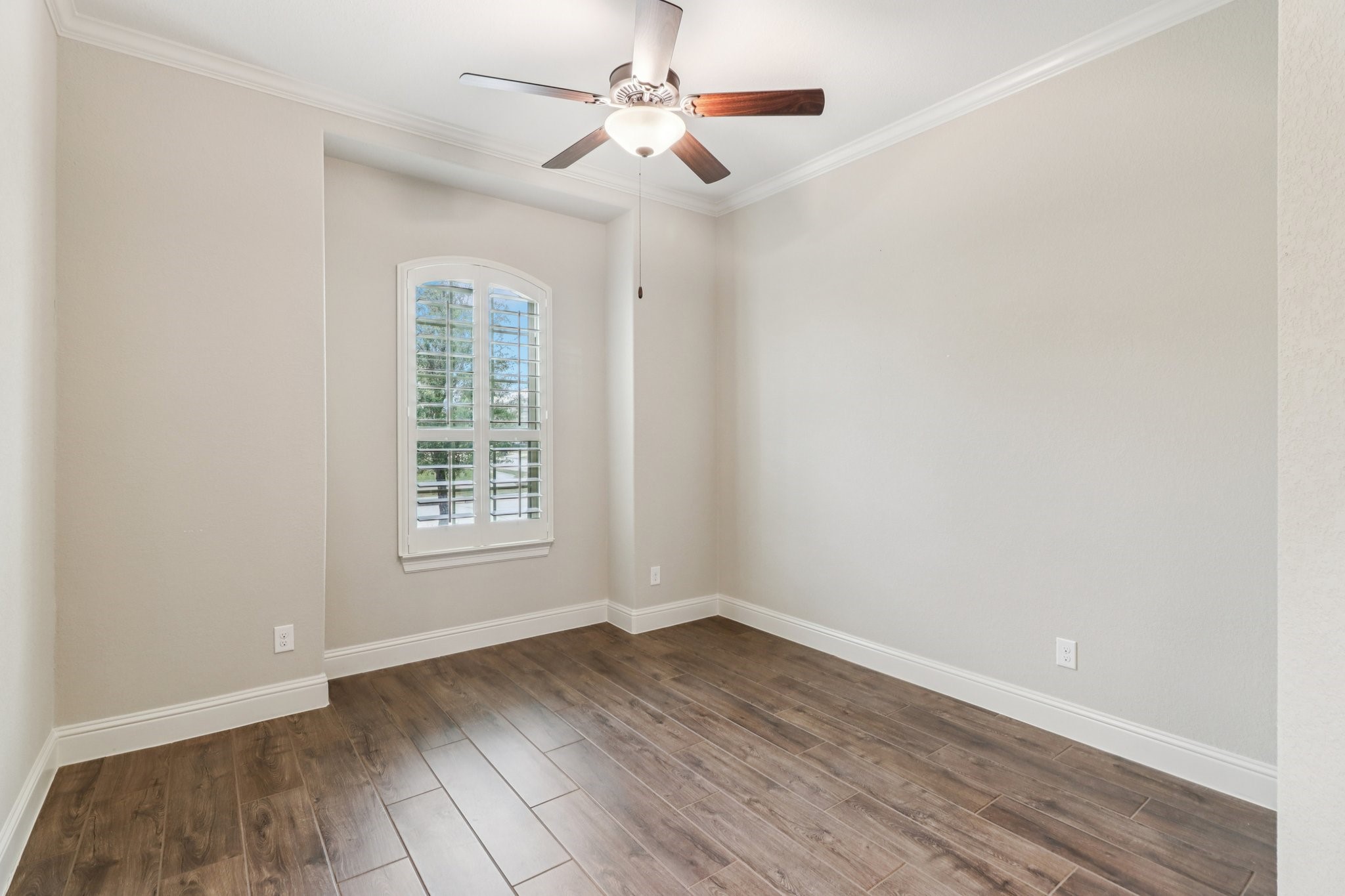 15519 Patten Forest Drive Cypress, TX 77429 - Photo 14 of 46 wooden floor in an empty room with a window