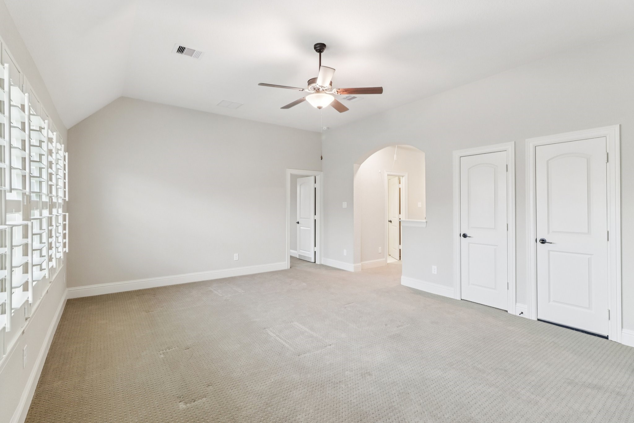 15519 Patten Forest Drive Cypress, TX 77429 - Photo 25 of 46 an empty room with chandelier fan and windows