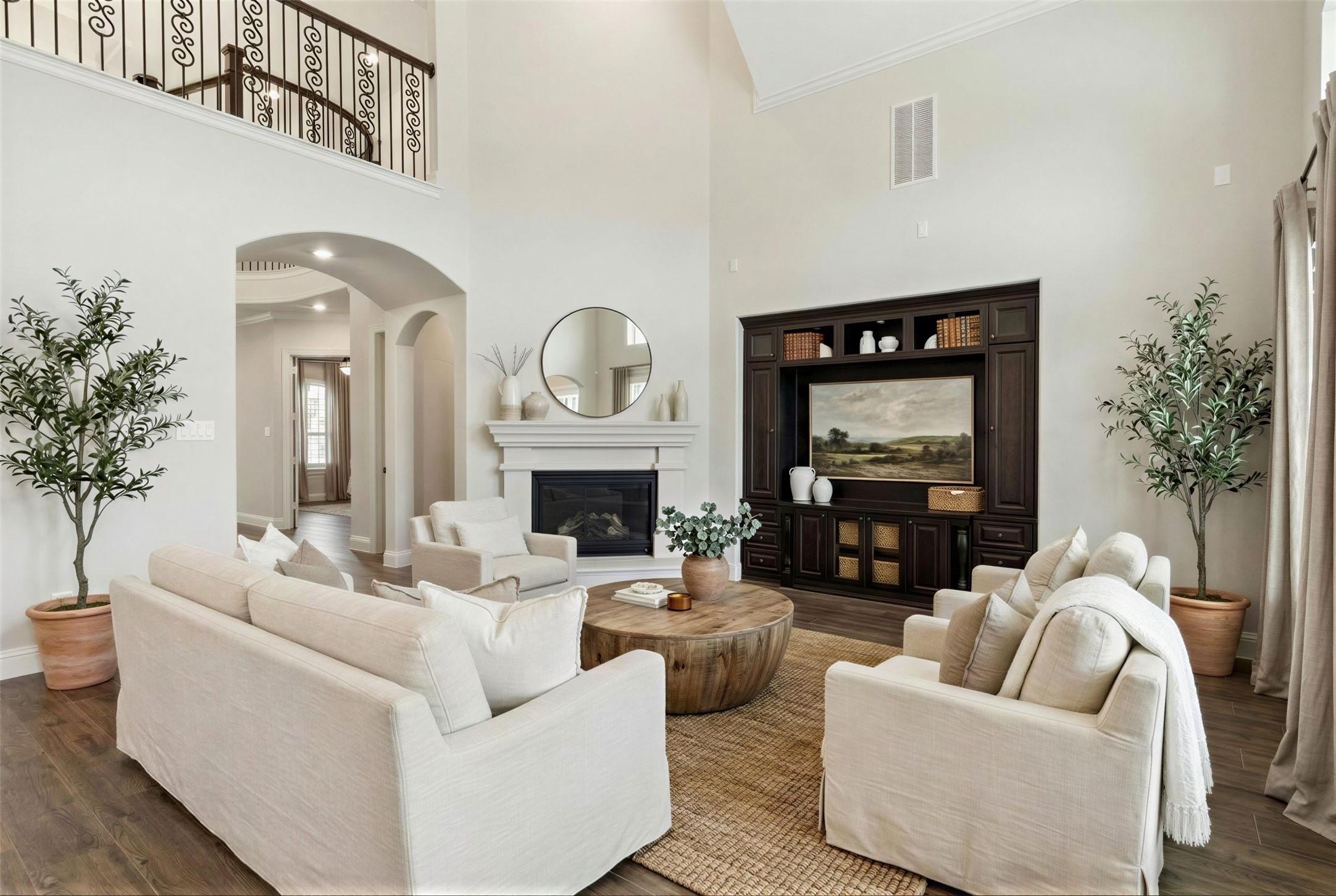 15519 Patten Forest Drive Cypress, TX 77429 - Photo 5 of 46 a living room with furniture a fireplace and potted plants