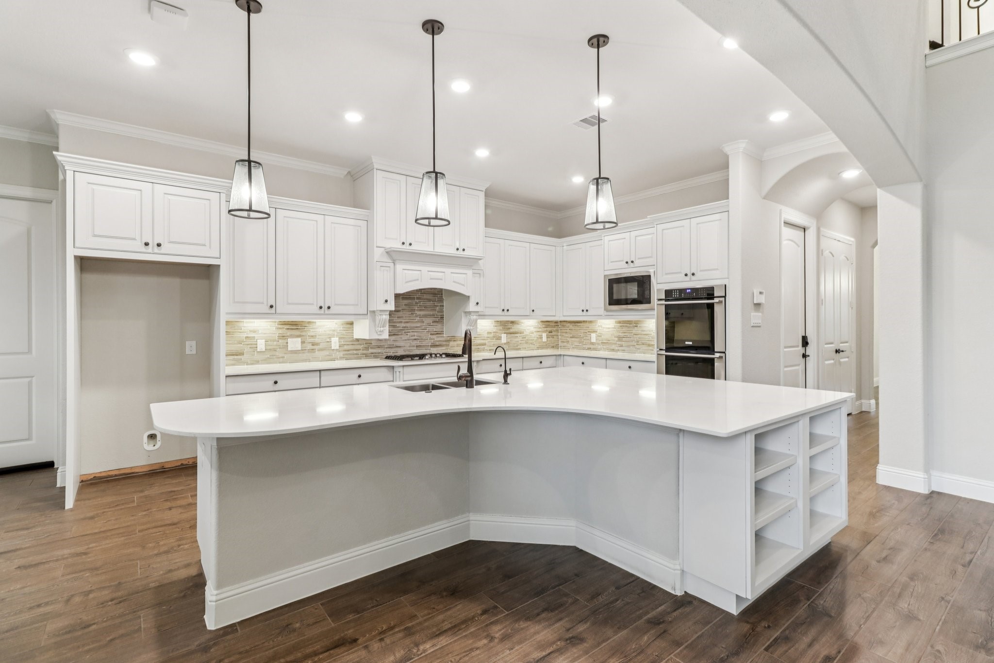 15519 Patten Forest Drive Cypress, TX 77429 - Photo 8 of 46 a kitchen with stainless steel appliances sink refrigerator and wooden floor