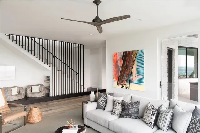 a living room with furniture and wooden floor