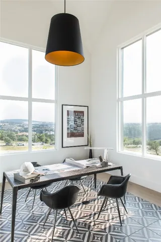 a view of a house with pool table and chairs