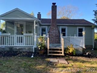 3 Maxson Road Groton, CT 06340 - Photo 1 of 15 a view of a house with a yard and potted plants