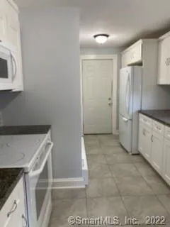 a view of a kitchen with cabinets
