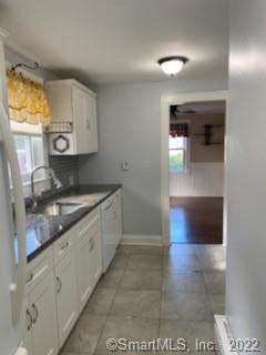 3 Maxson Road Groton, CT 06340 - Photo 4 of 15 a bathroom with a sink and a mirror