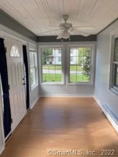 a view of an empty room with a window