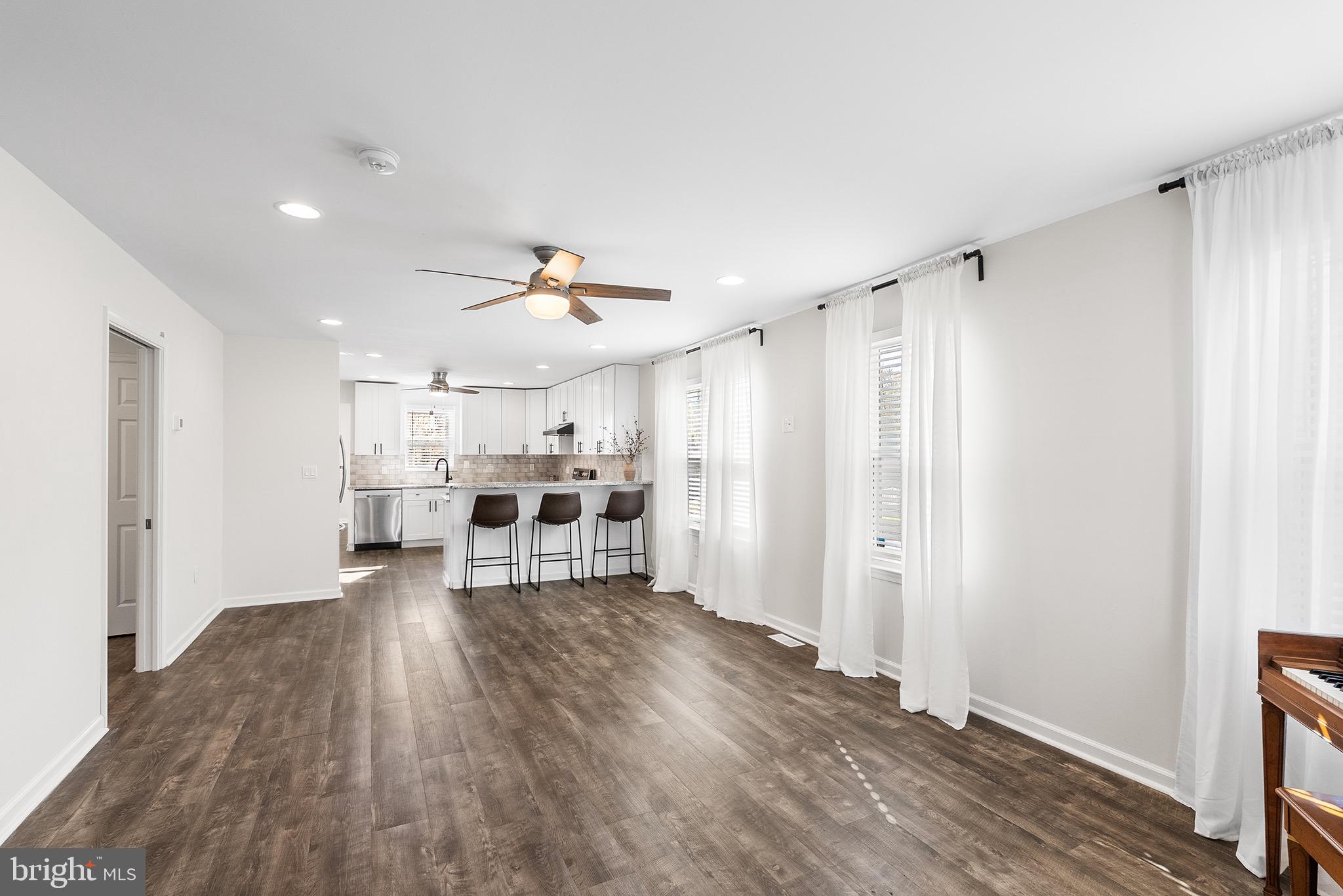 405 Walnut Street Marcus Hook, PA 19061 - Photo 2 of 24 Spacious, sunlit open-concept living area.
