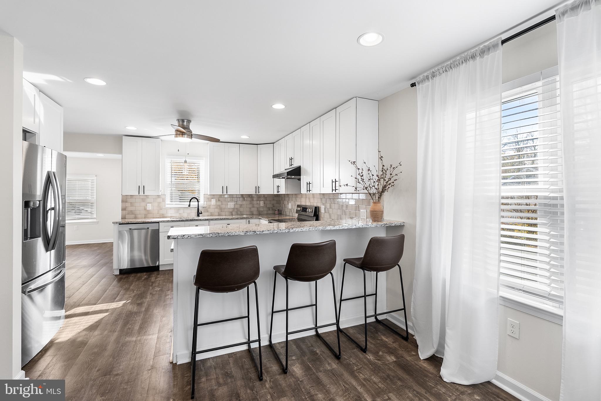 405 Walnut Street Marcus Hook, PA 19061 - Photo 4 of 24 Modern kitchen with sleek design and light.