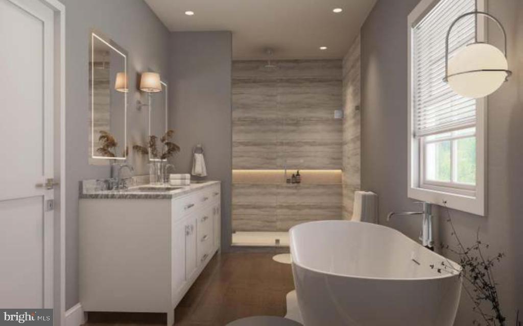 8317 Maplewood Drive Manassas, VA 20111 - Photo 4 of 11 a bathroom with a granite countertop sink mirror and bathtub