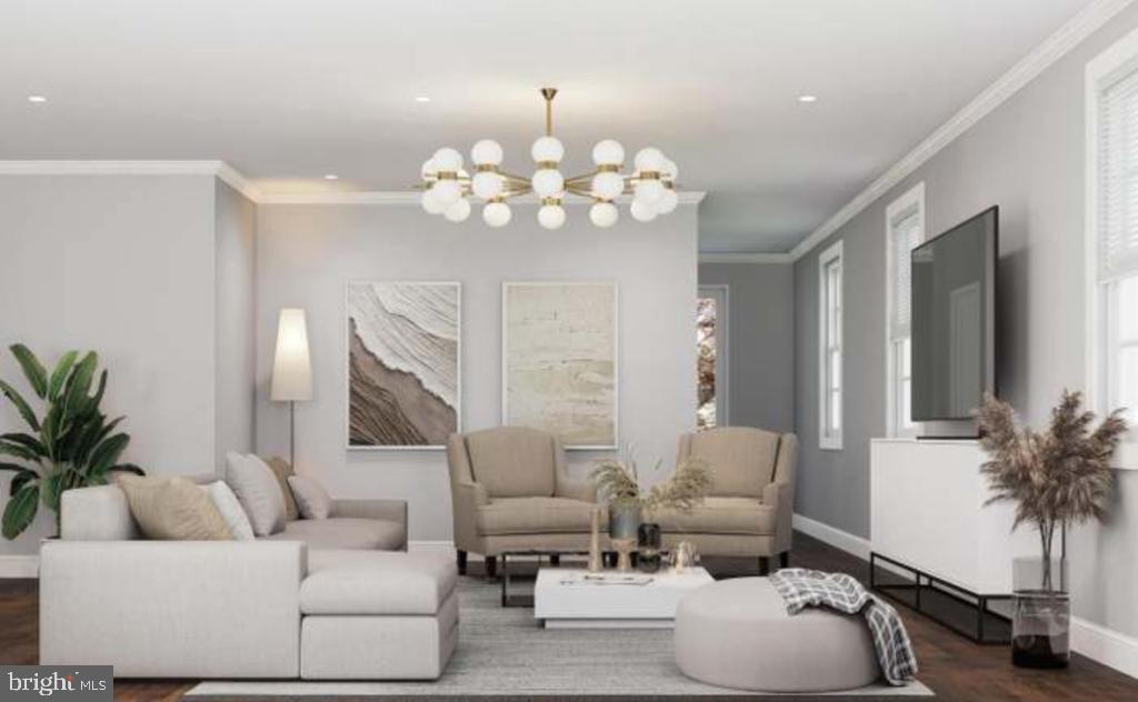 8317 Maplewood Drive Manassas, VA 20111 - Photo 8 of 11 a living room with furniture a chandelier and a flat screen tv