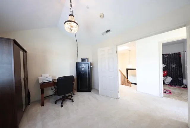 a view of a workspace with furniture