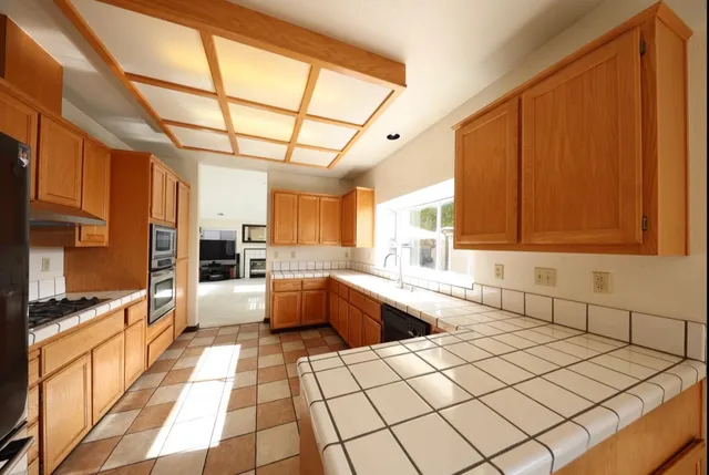 a large kitchen with a large window