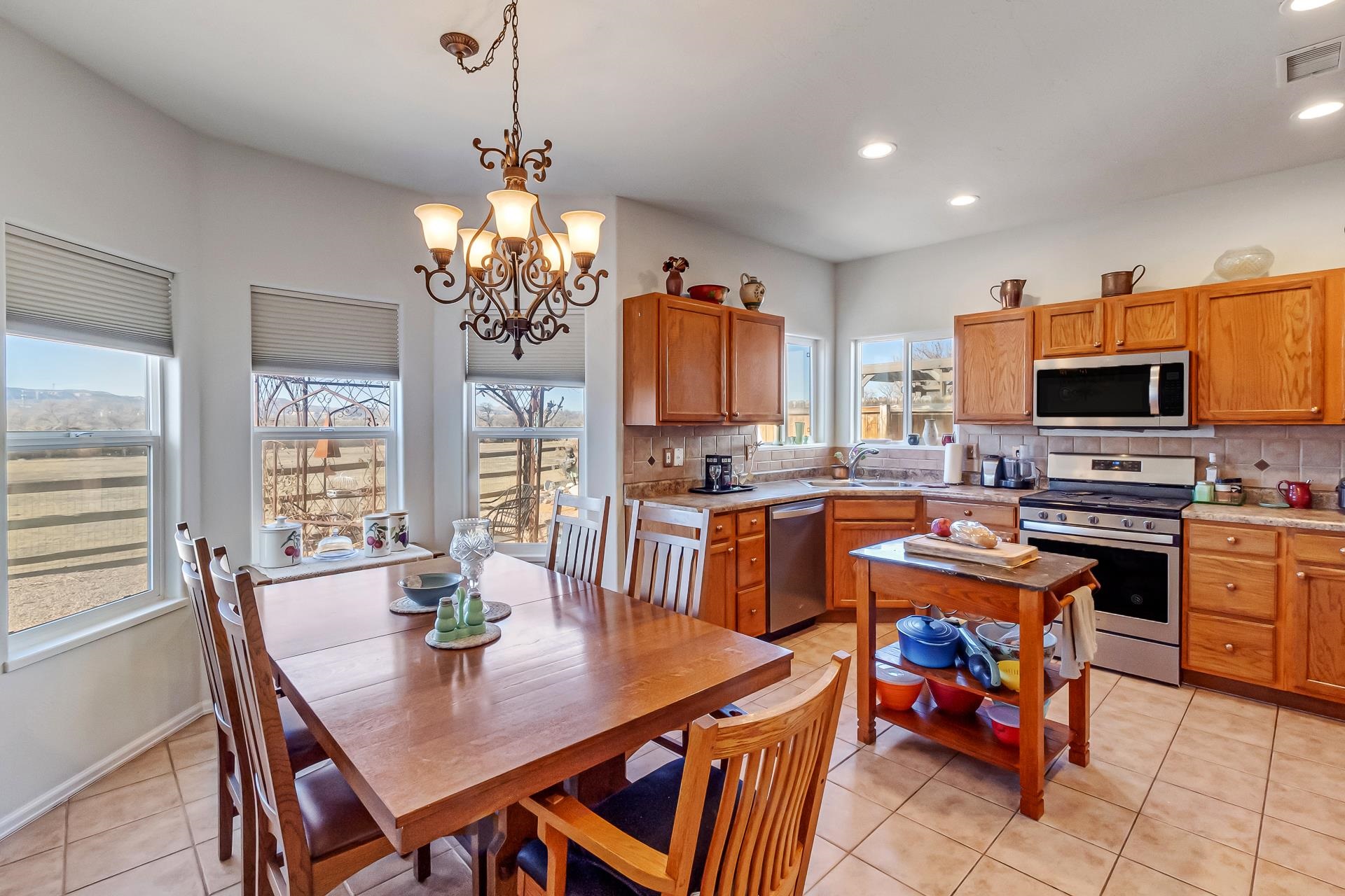 701 Amethyst Drive Fruita, CO 81521 - Photo 13 of 39 a view of a dining room with furniture a chandelier and wooden floor