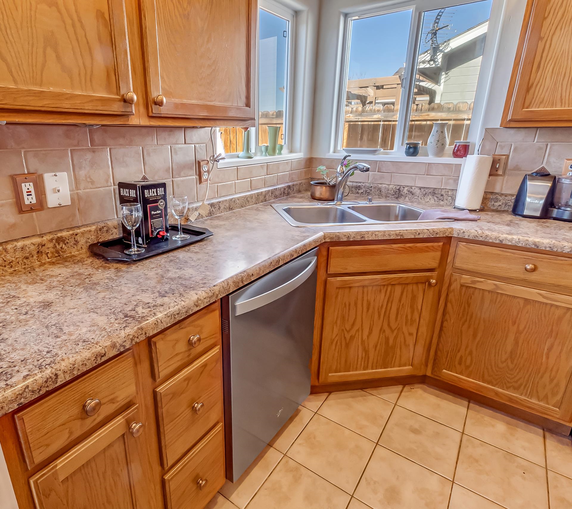 701 Amethyst Drive Fruita, CO 81521 - Photo 15 of 39 a kitchen with stainless steel appliances granite countertop a sink and cabinets