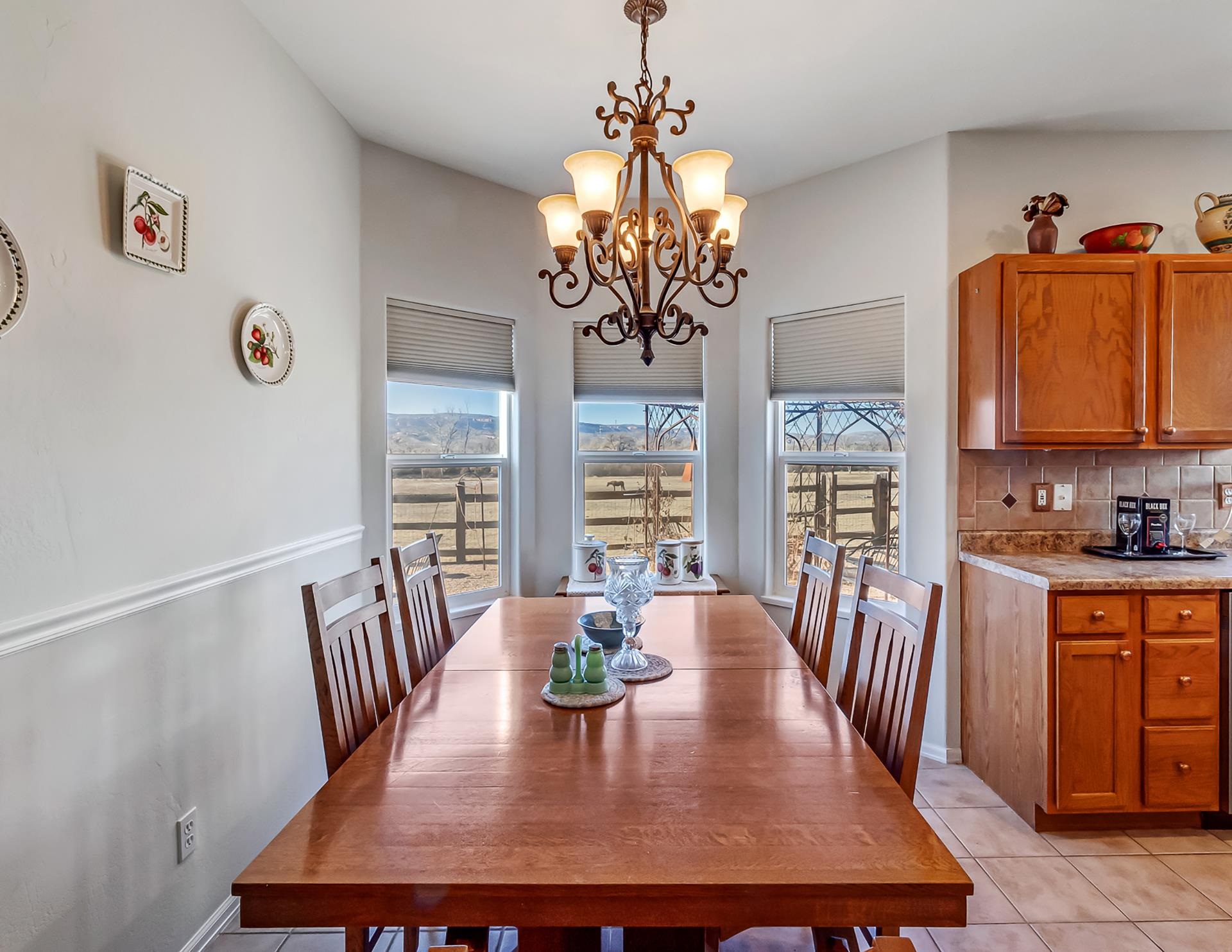 701 Amethyst Drive Fruita, CO 81521 - Photo 16 of 39 a view of a dining room with furniture window and wooden floor
