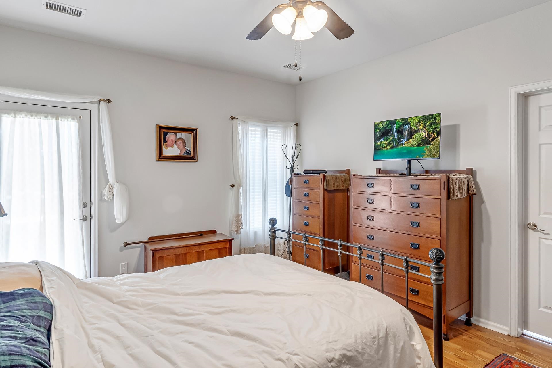 701 Amethyst Drive Fruita, CO 81521 - Photo 17 of 39 a bedroom with a bed and a chandelier