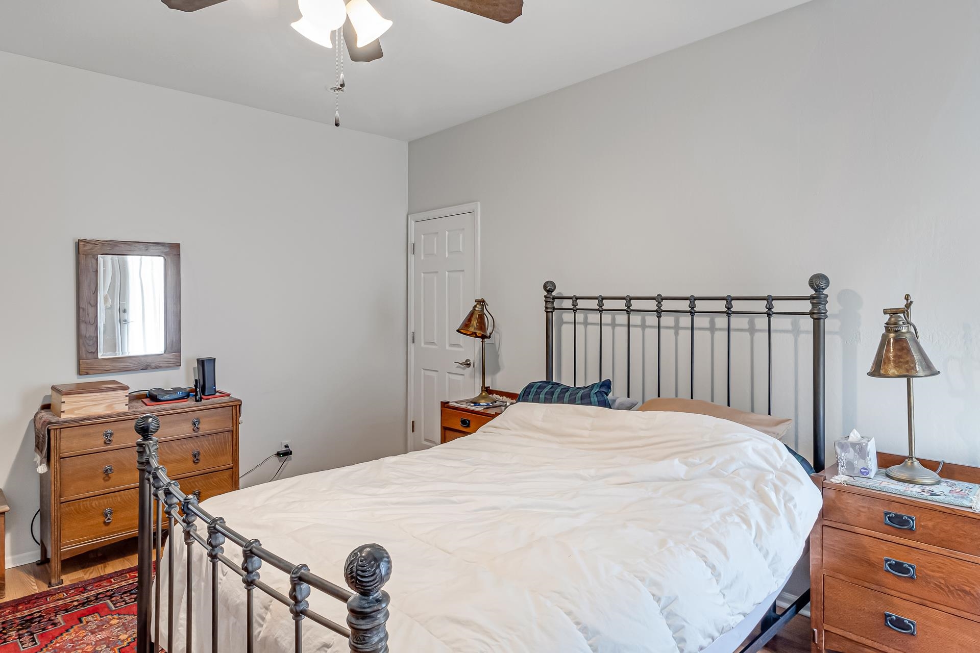 701 Amethyst Drive Fruita, CO 81521 - Photo 18 of 39 a bed room with a bed and a chandelier