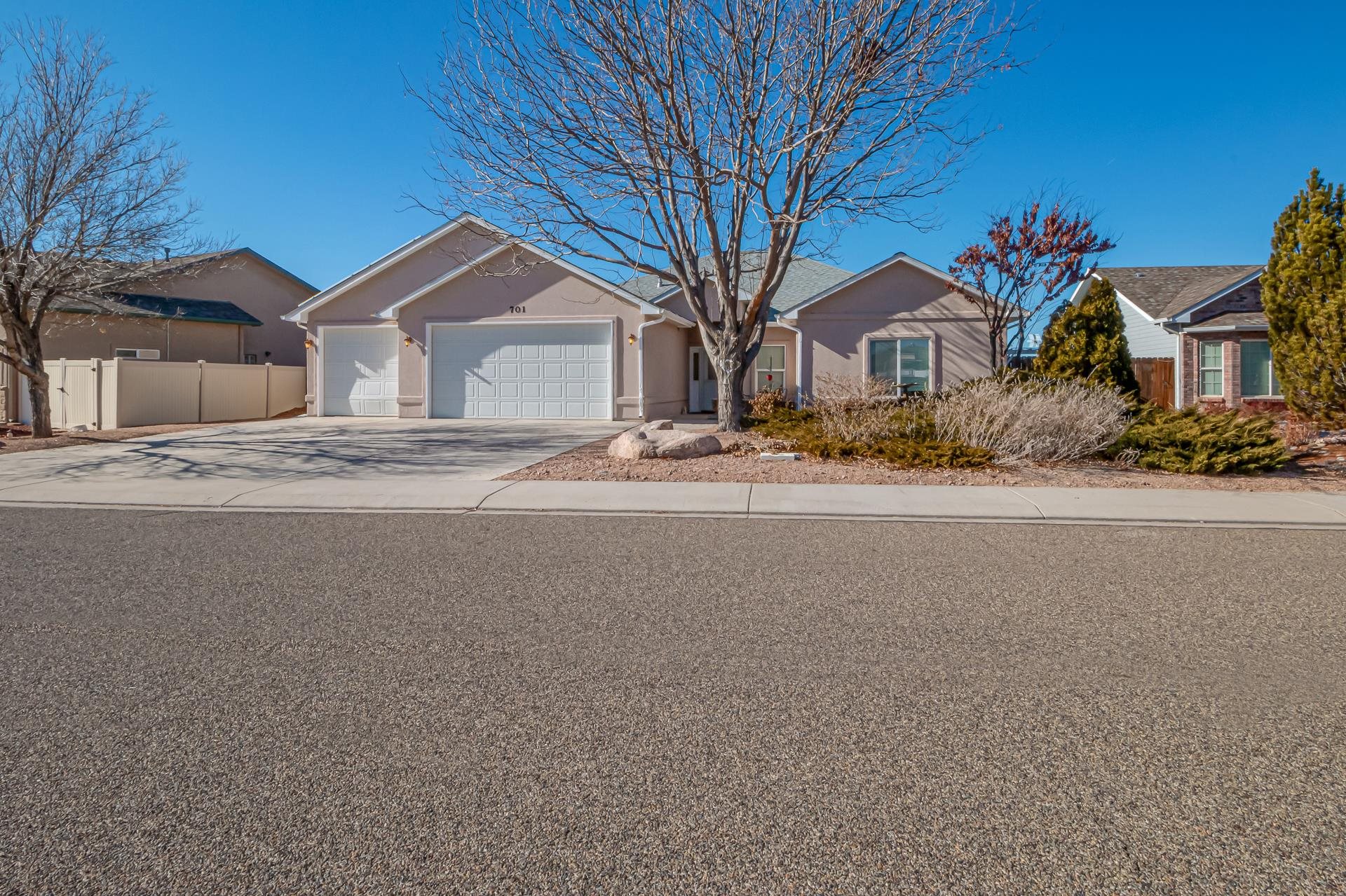 701 Amethyst Drive Fruita, CO 81521 - Photo 2 of 39 a front view of a house with a yard