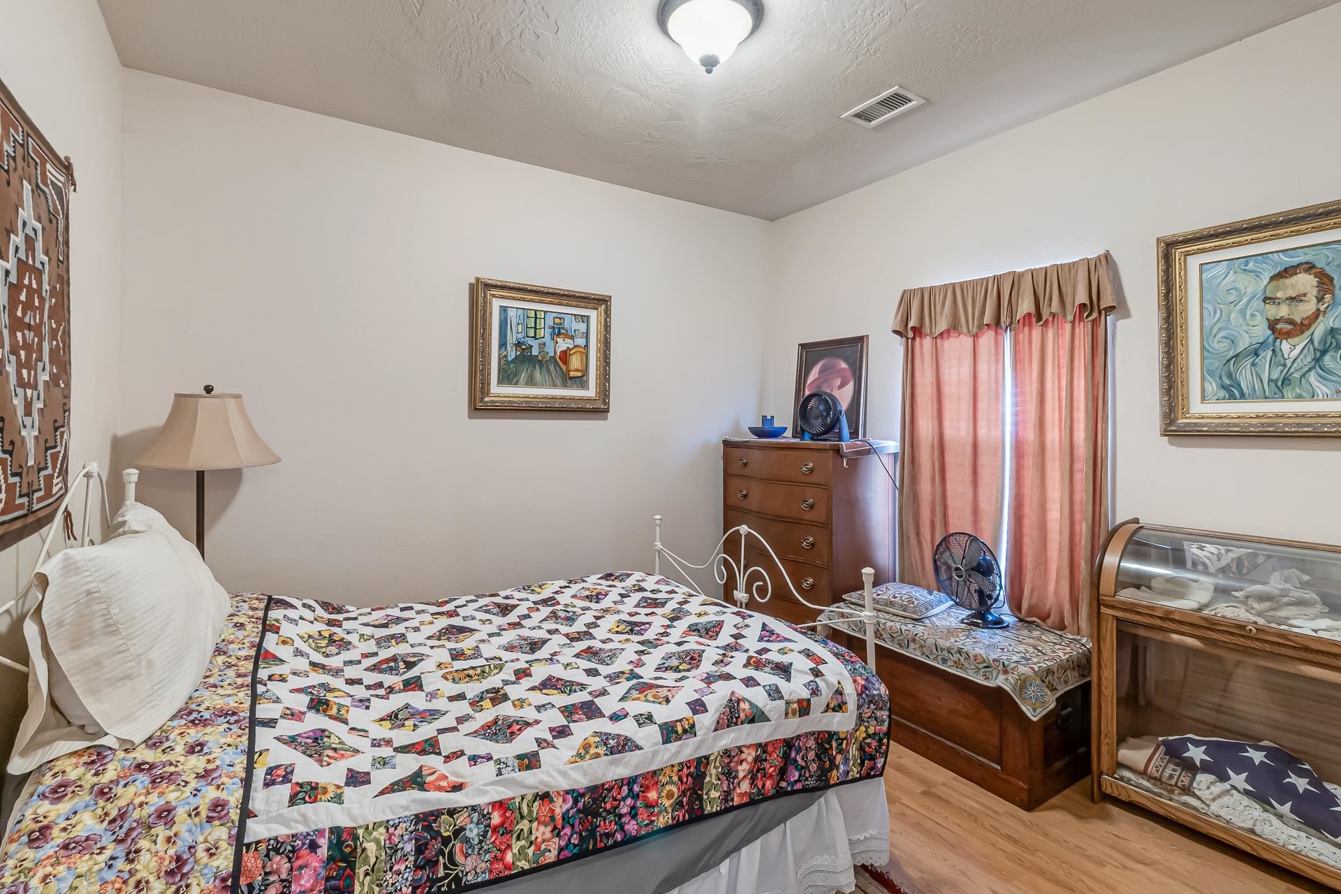 701 Amethyst Drive Fruita, CO 81521 - Photo 23 of 39 a bedroom with a bed and wooden floor