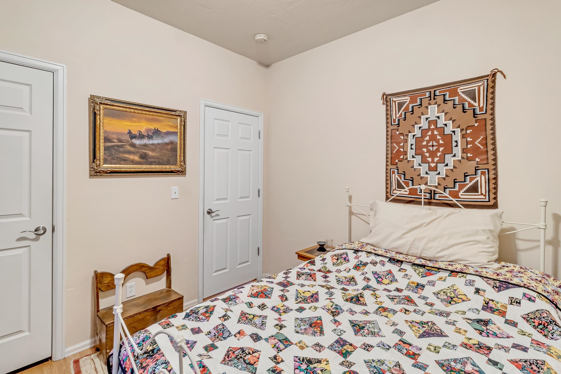 701 Amethyst Drive Fruita, CO 81521 - Photo 24 of 39 a bedroom with a bed and a lamp on dresser