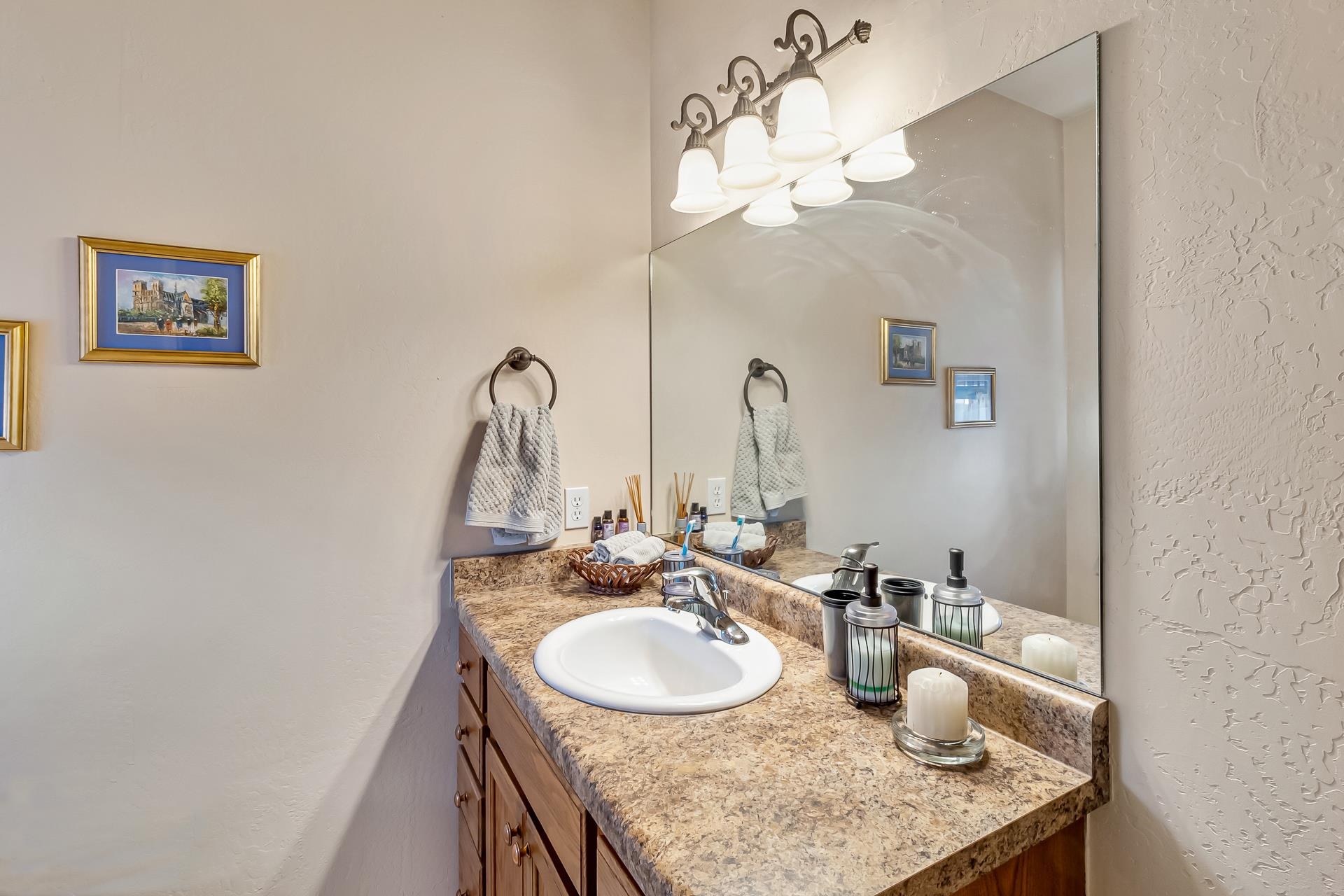 701 Amethyst Drive Fruita, CO 81521 - Photo 25 of 39 a bathroom with a granite countertop sink a mirror and vanity