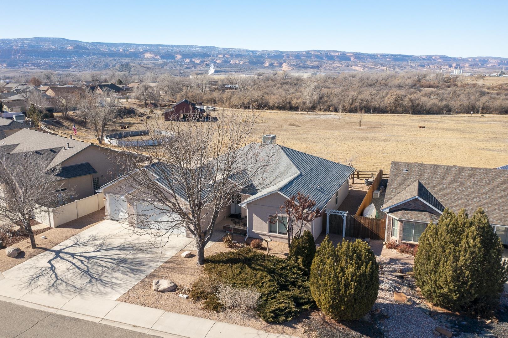 701 Amethyst Drive Fruita, CO 81521 - Photo 35 of 39 an aerial view of residential houses with outdoor space and ocean view