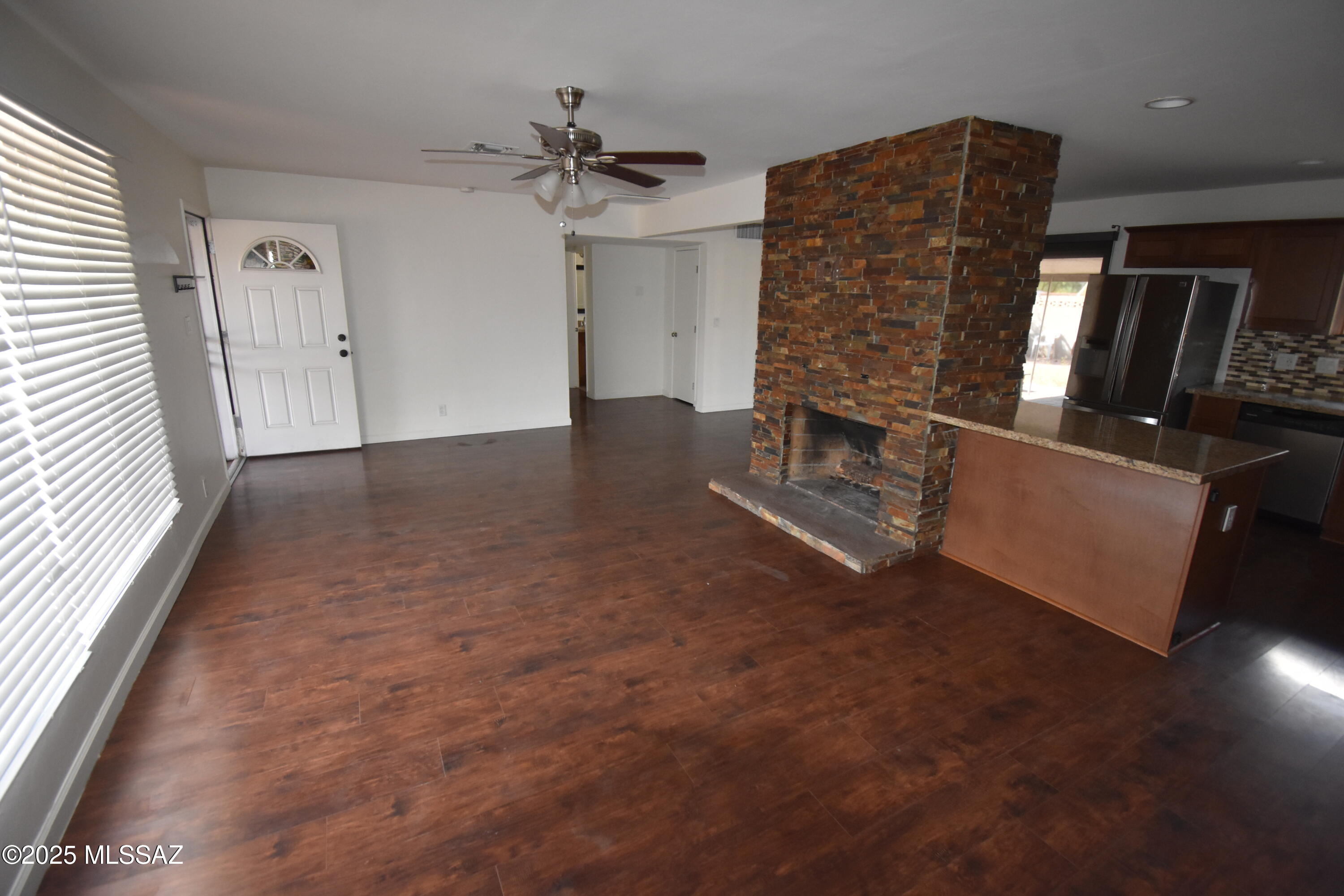 5501 East Spring Street Tucson, AZ 85712 - Photo 16 of 32 wooden floor in an empty room with a window