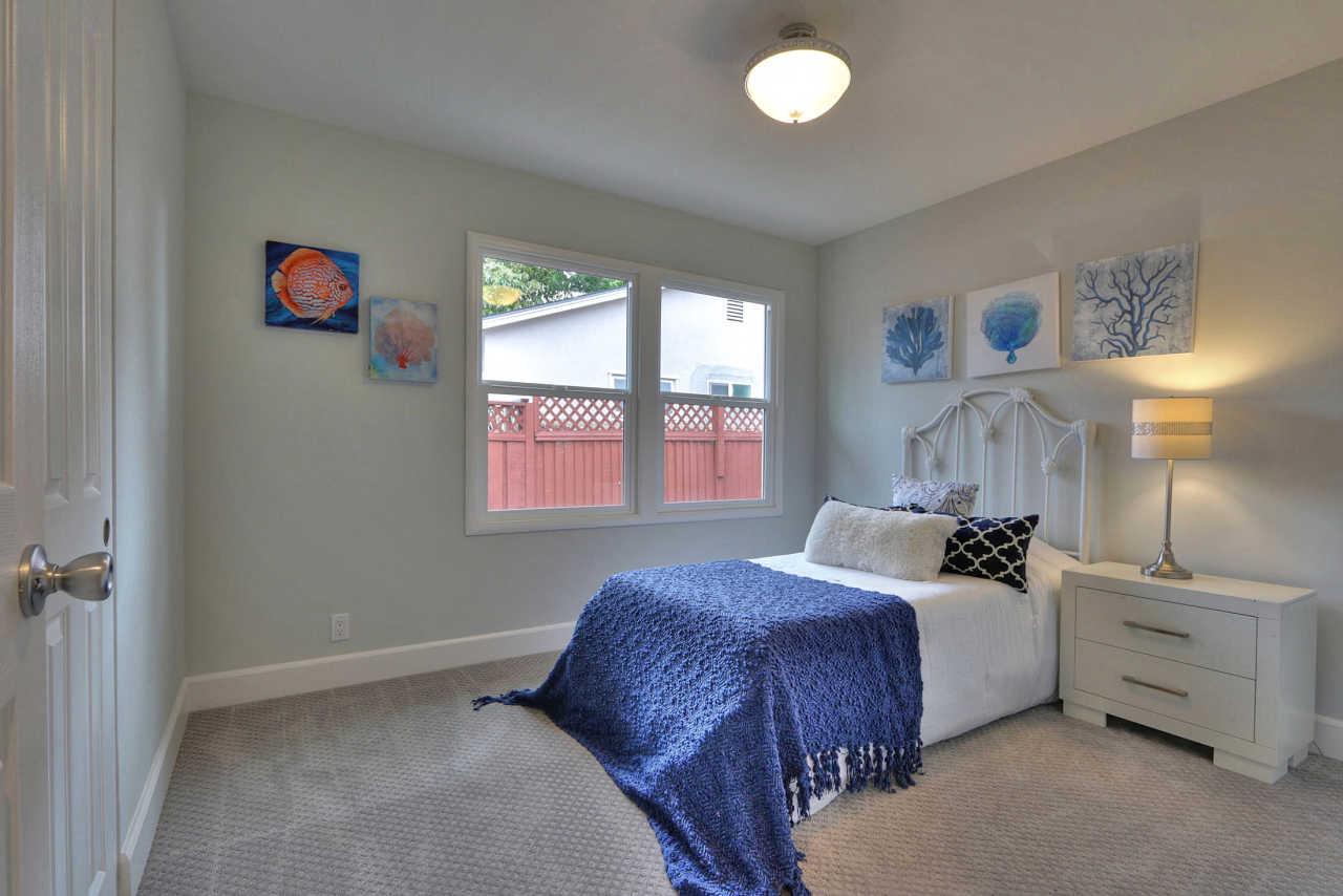 1350 Phyllis Avenue Mountain View, CA 94040 - Photo 12 of 27 a bedroom with a bed and a window