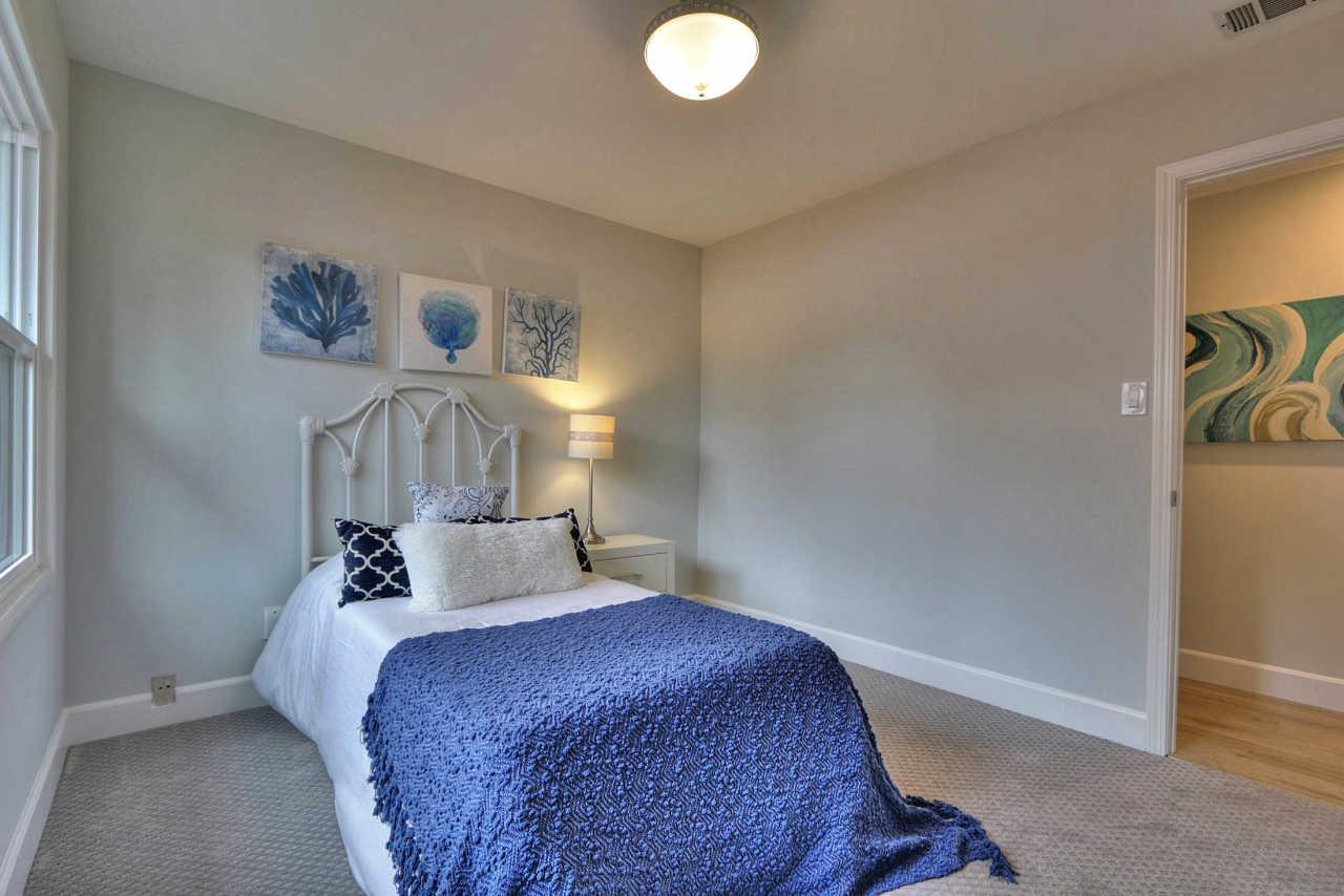 1350 Phyllis Avenue Mountain View, CA 94040 - Photo 13 of 27 a bedroom with a bed and a table in it