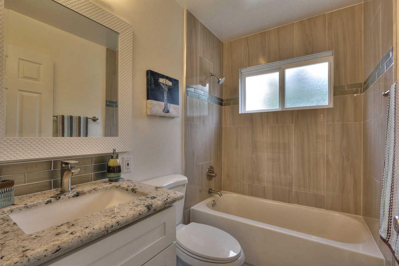 1350 Phyllis Avenue Mountain View, CA 94040 - Photo 17 of 27 a bathroom with a granite countertop sink toilet tub and shower