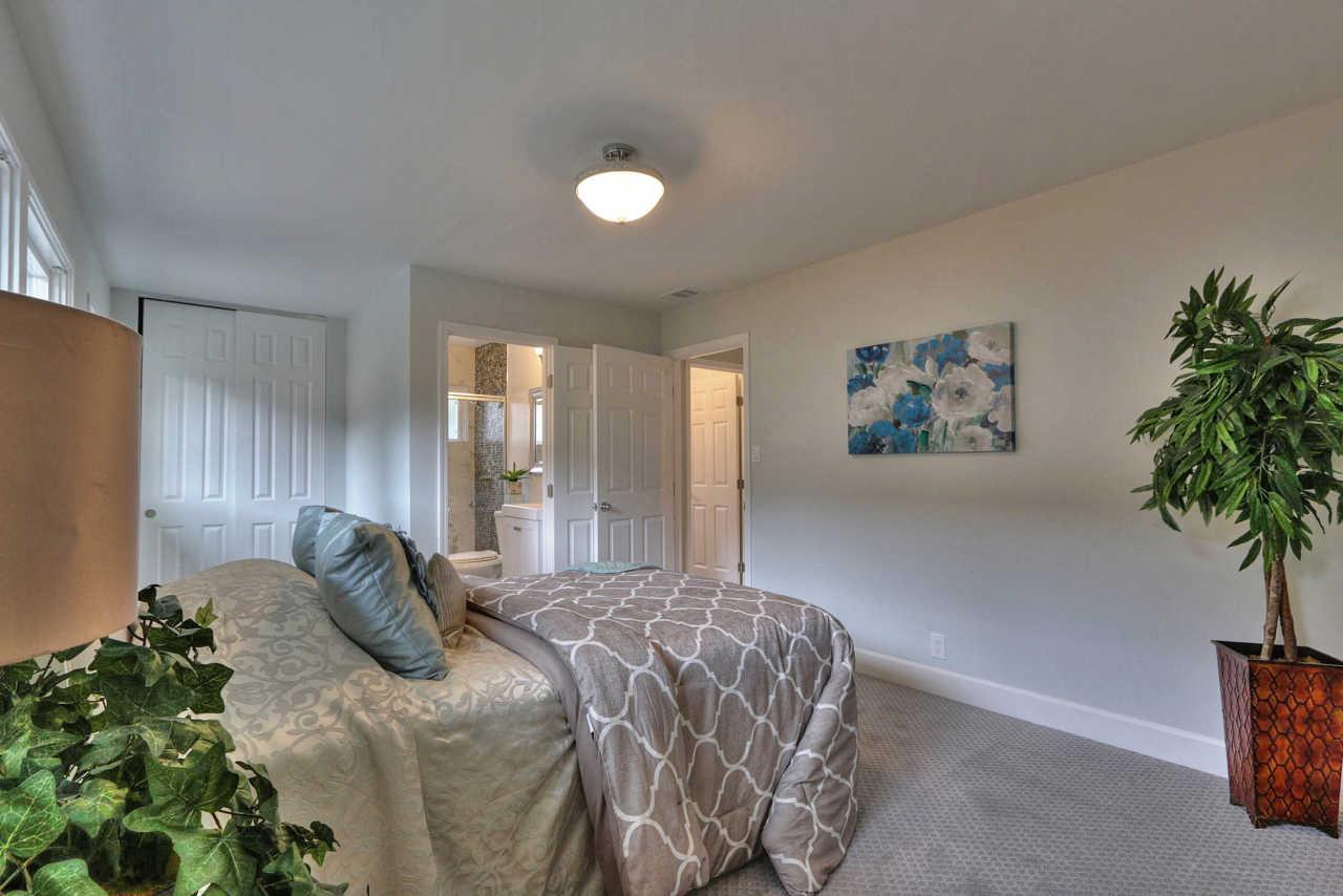 1350 Phyllis Avenue Mountain View, CA 94040 - Photo 19 of 27 a bedroom with a bed and a potted plant