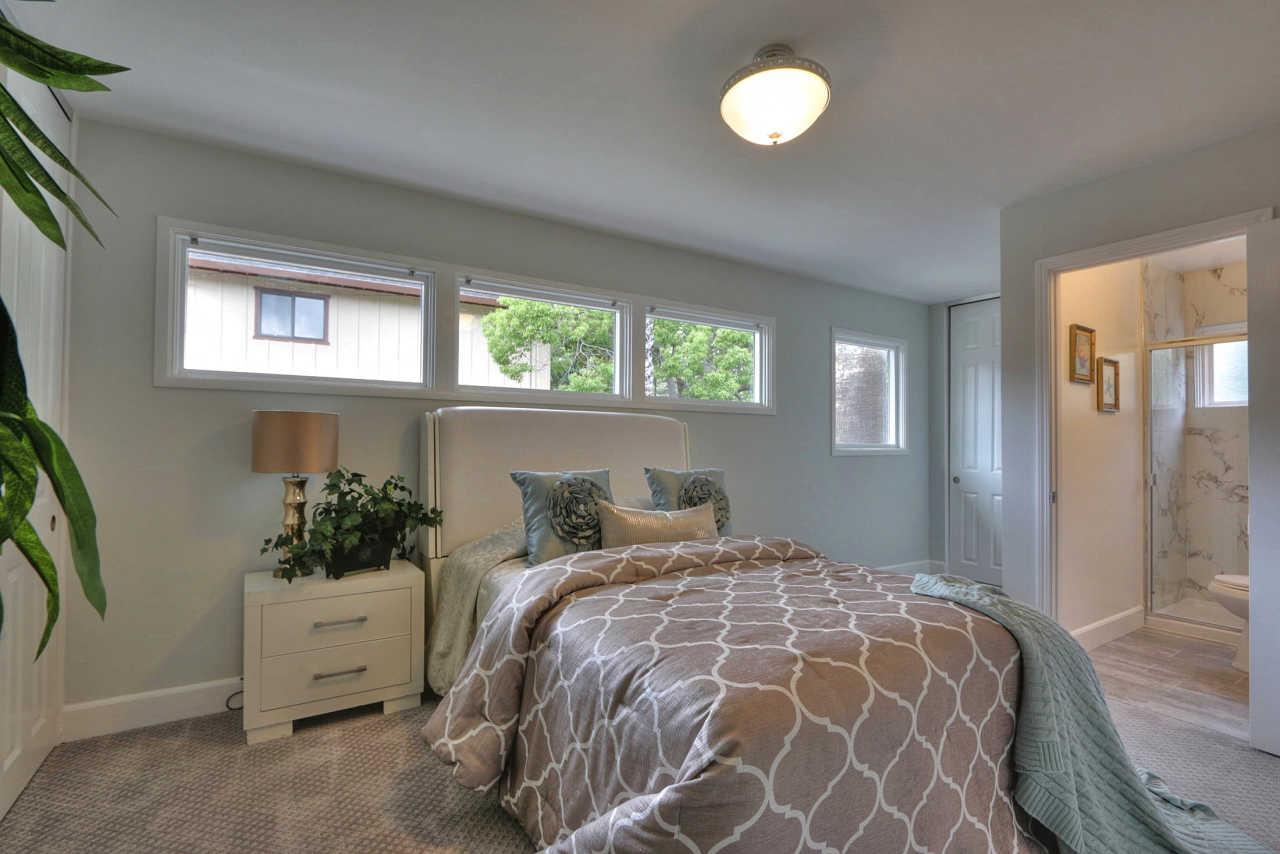 1350 Phyllis Avenue Mountain View, CA 94040 - Photo 20 of 27 a bedroom with a bed and a potted plant