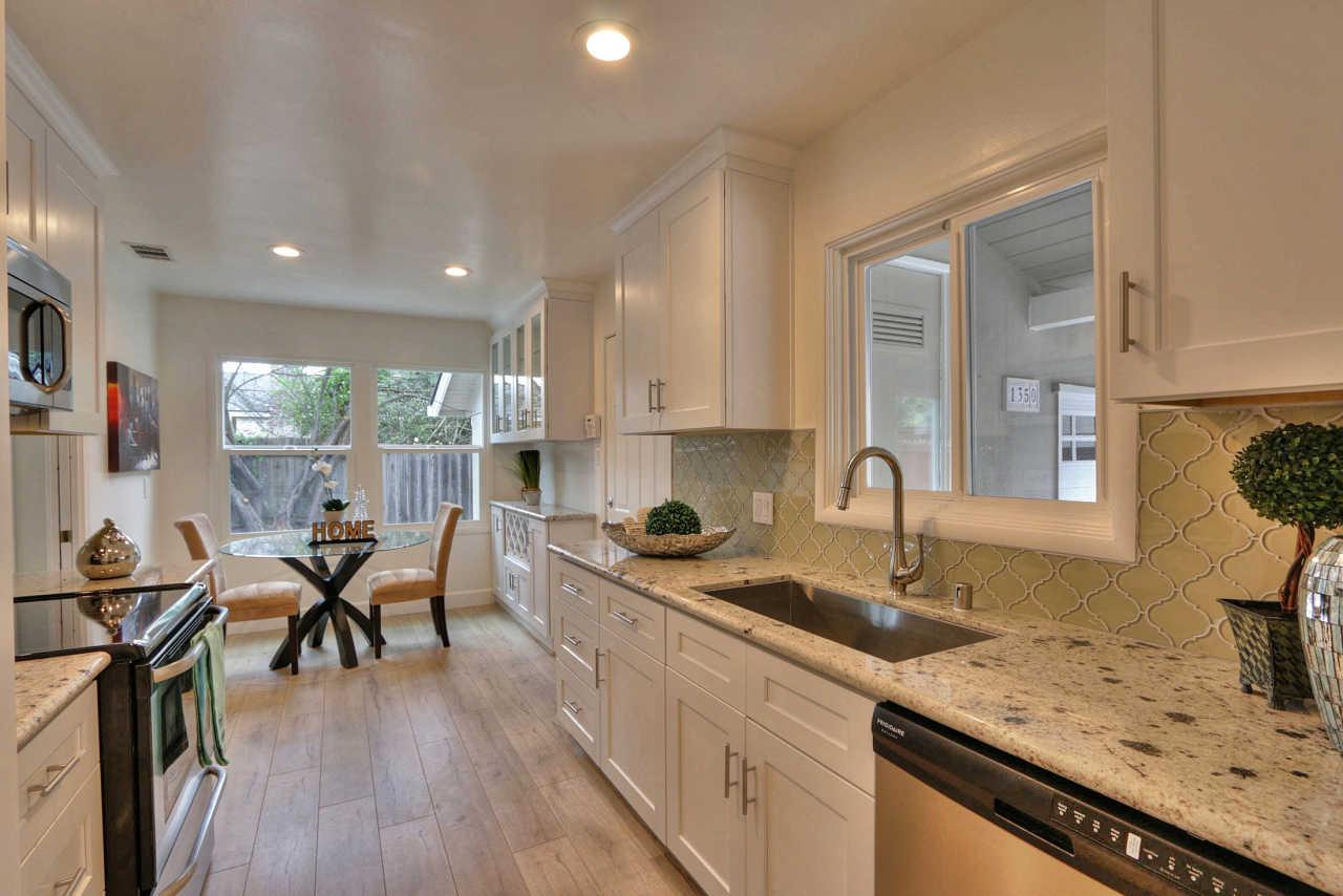 1350 Phyllis Avenue Mountain View, CA 94040 - Photo 2 of 27 a kitchen with granite countertop sink stove and cabinets