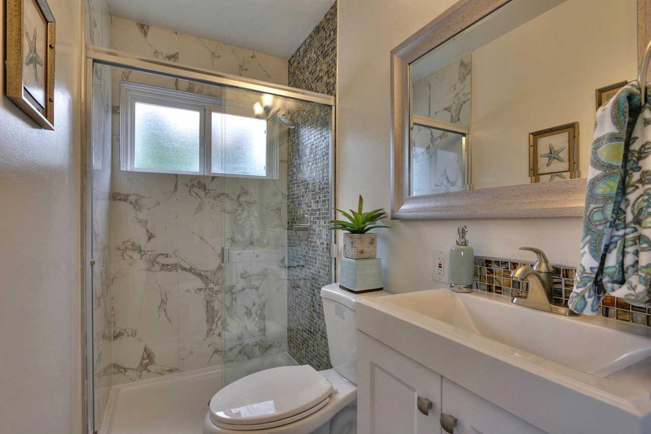 1350 Phyllis Avenue Mountain View, CA 94040 - Photo 21 of 27 a bathroom with a sink a toilet and shower